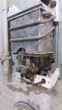 Junkers: Low Pressure & No Hot Water Issue - Cleaning Plastic Filings from Filter (Photos)