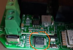 Close-up of a circuit board with an integrated circuit labeled 8H3K64S2.