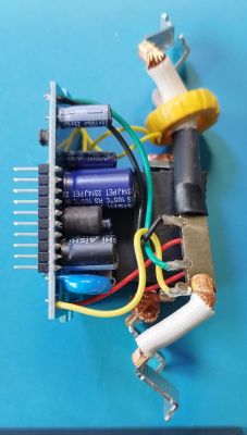 Internal Circuitry of Aliexpress Device Internal circuitry of a device from Aliexpress with visible capacitors and wiring.