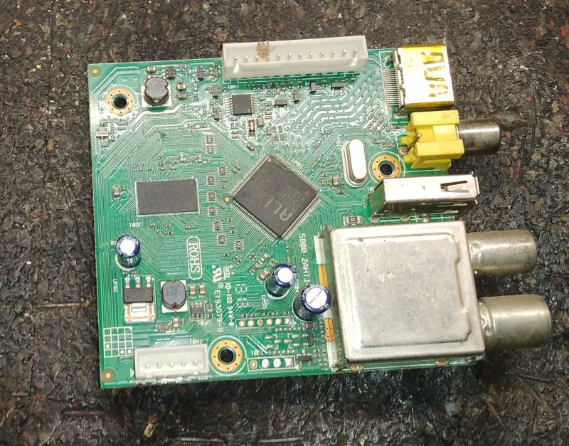 PCB with ICs, RCA connectors, USB port, and TV tuner module