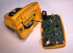 Interior of a metal detector showing the PCB and battery compartment.