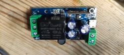 Printed circuit board with electronic components and a relay.