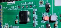 Close-up of a Tuya temperature and humidity sensor circuit board with highlighted components.