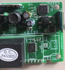 Circuit board with visible microchips and capacitors.
