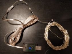 LED string lights with USB plug and control button.