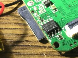 Close-up of a PCB with electronic components, including a chip labeled GDPJ280 and a microSD slot.