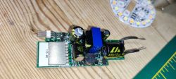 Electronic module with components on a wooden table.