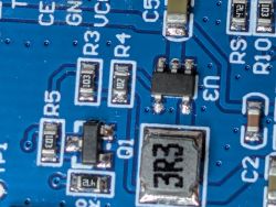 Image of a circuit board with resistors and integrated circuits visible.