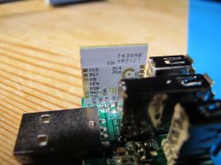 Close-up of a circuit board with a CBU module and USB ports.