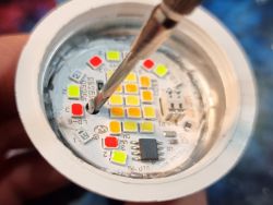 LED GU10 Bulb Modification Close-up of the internal part of an LED bulb showing diodes and a microchip.