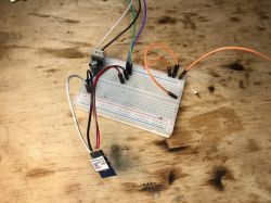 Setup of Electronic Components on a Breadboard Close-up of a breadboard with connected wires and electronic components.