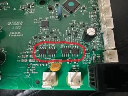 Four IRF integrated circuits on a coffee machine PCB, marked with red pen