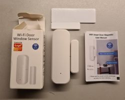 Tuya Wi-Fi door sensor set with packaging and user manual.