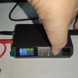Close-up of DP100 power supply with active display and connected wires