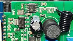 Close-up of an integrated circuit on a circuit board with visible electronic components.