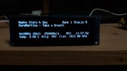 Display showing information about playing music and weather parameters.