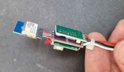 Close-up of a CB2S module with additional level shifter and step-down converter boards.