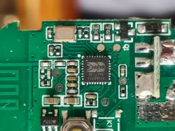 Close-up of a circuit board with an integrated circuit and various electronic components.