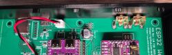 Close-up of a PCB with electronic components and wires.