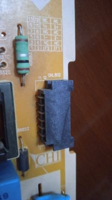 A section of a circuit board with CNL802 connector and a resistor.