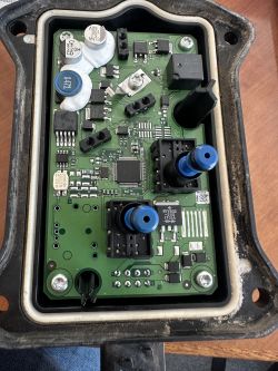 Circuit board with electronic components inside a housing.