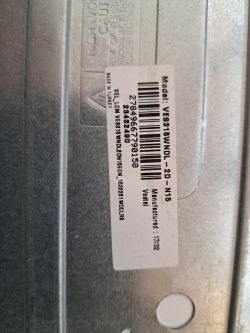 Label with model information and technical drawing.
