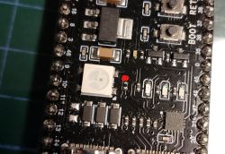 Close-up of a PCB with a cut trace between an RGB LED and a resistor