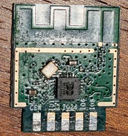 W3BK-01P module with antenna and IC on a PCB board, close-up from above