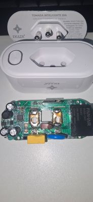 Disassembled EKAZA smart plug with exposed internal electronics