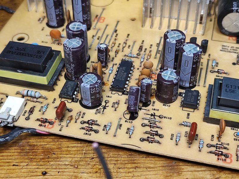 Electronic Circuit Board with Capacitors and Resistors Electronic circuit board with various components, including capacitors and resistors.