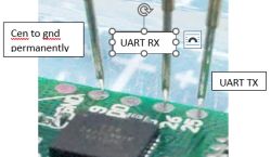 Probe connected to UART RX, UART TX, and CEN pins on a PCB.