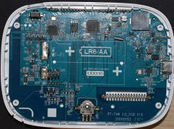 Printed circuit board with various electronic components, including a space for LR6 AA batteries.