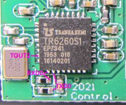 TR6260S1 Chip on PCB Close-up of TR6260S1 chip on PCB with labeled pins TOUT2, RXD0, and TXD0.