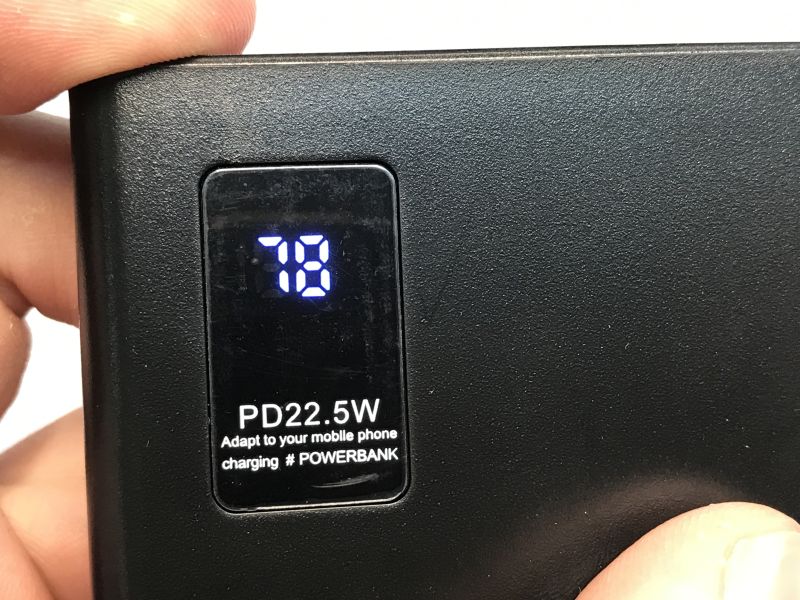 Close-up of power bank screen showing 78% charge and PD 22.5W label