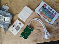 Magic Home BL602 controller components, infrared remote, and PCB.