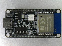 Microcontroller module with visible electronic components.