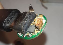 Damaged Interior of AA Battery Interior of an AA battery with damaged electronics and corrosion.