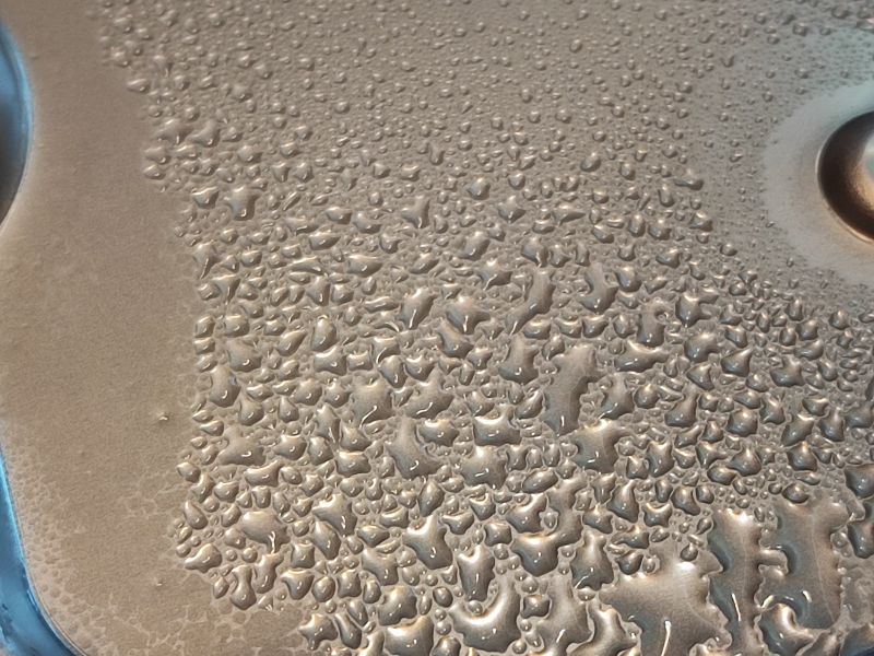 Moisture on Hard Disk Water droplets on a hard disk surface.