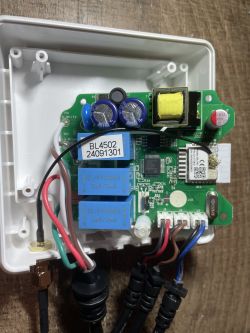 View of the interior of a 3-phase energy meter with visible electronic components.