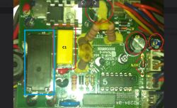 Close-up of a PCB with a relay and a yellow capacitor labeled C1 highlighted