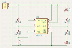 Circuit schematic with NE555 timer, two LEDs, and four resistors