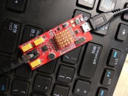 USB Sound Card Prototype on Keyboard Prototype USB sound card circuit board placed on a keyboard.