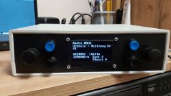 Electronic device with a display showing Radio MBOX, track Urszula - Malinowy Kr, and audio parameters.