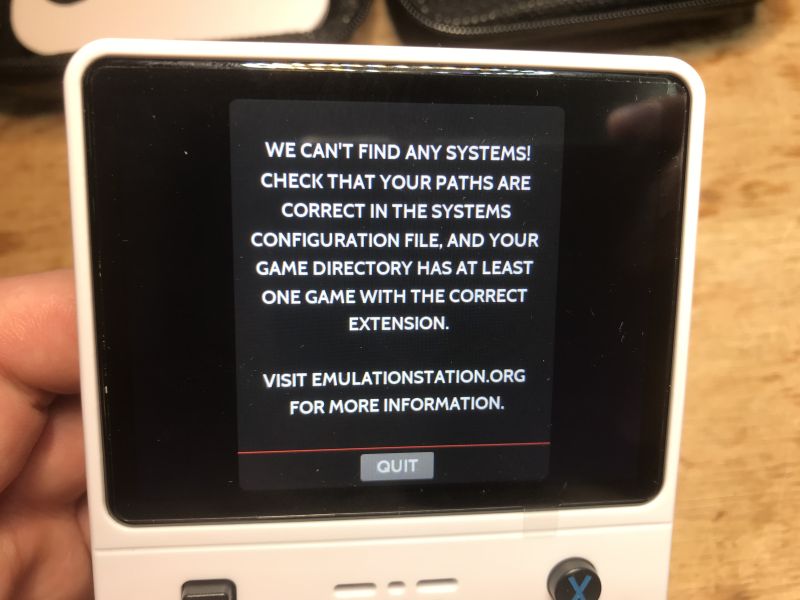 Retro handheld screen with system not found message referring to emulationstation.org