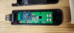 Disassembled USB Device with CB3S Board Open USB device case with visible PCB.