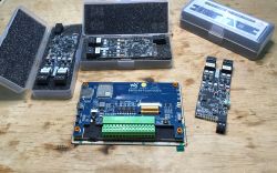 Electronic modules with a touch display on a table.