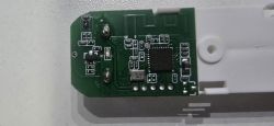Green PCB with an IC and SMD components mounted on a white plastic housing