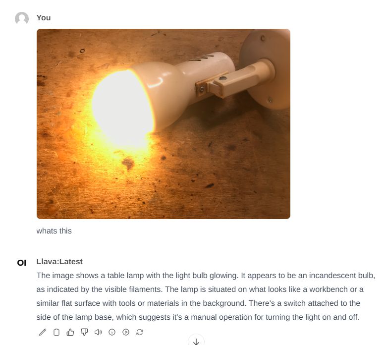 Glowing Light Bulb on Desk A light bulb glowing on a base, lying on a wooden surface.