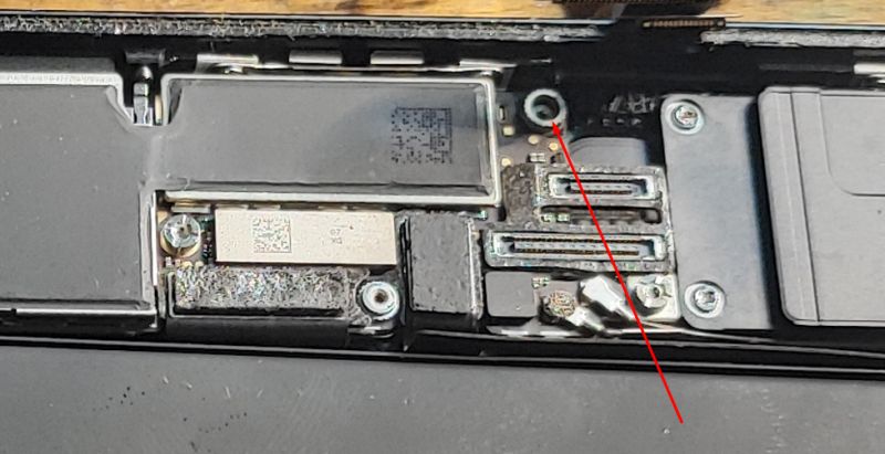 Interior of iPhone with Marking Close-up of an open iPhone interior, marked with an arrow.