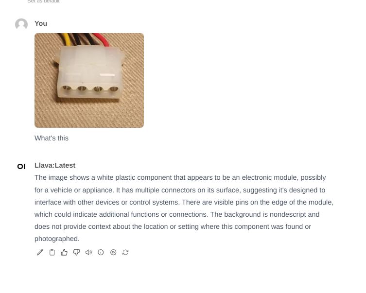 The image shows a white plastic component with several wires, likely a Molex connector used in electronics.